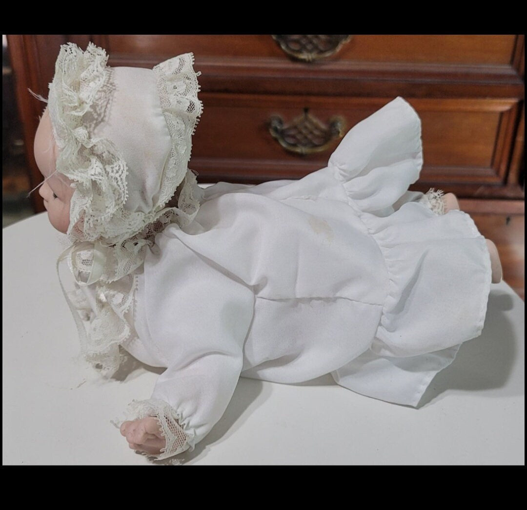 9 inch long porcelain baby doll
